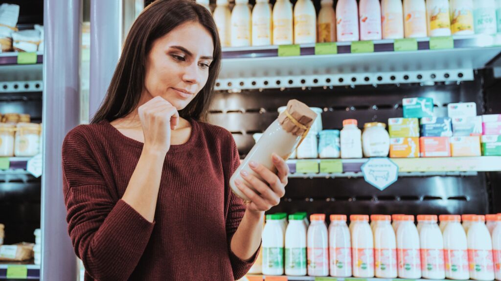 Consumer choosing refrigerated goods.